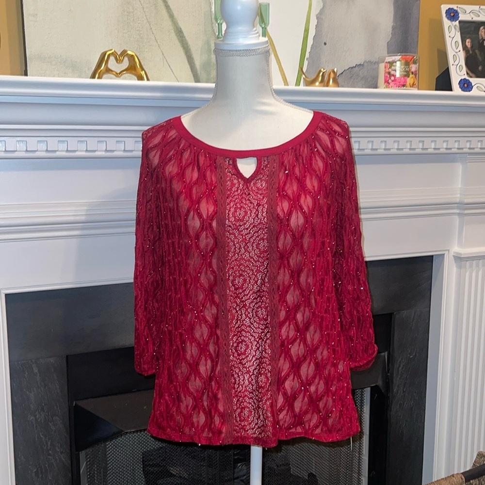 Burgundy blouse with pretty details.